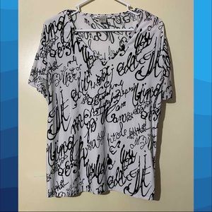 Black and white tee with script from Nygård
